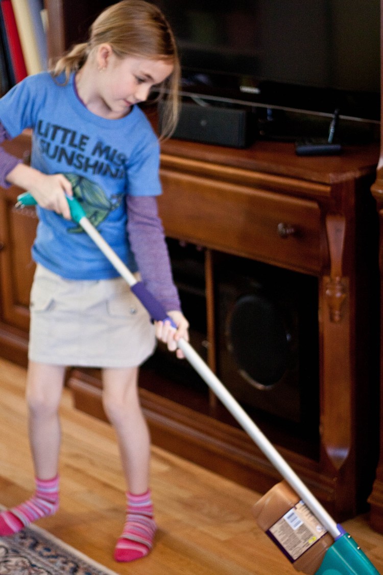 Young girl mopping