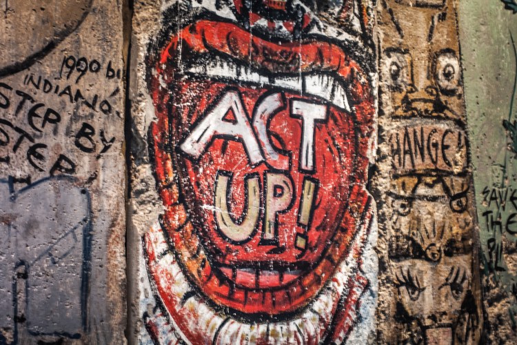 A piece of the Berlin Wall on exhibit at the Newseum in Washington D.C. has an open mouth with the words ACT UP painted in the mouth NotSoSAHM