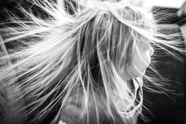 Girl sits in chair with static charged hair flying out all around her NotSoSAHM