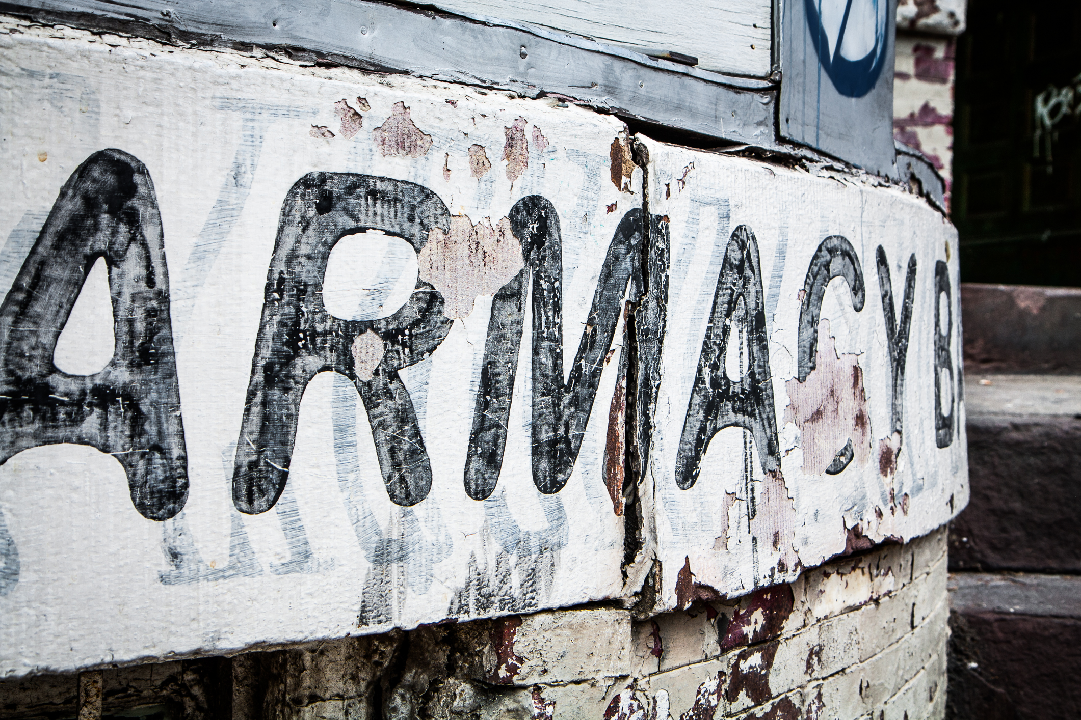 Layers of paint advertise various businesses in Adams Morgan Not So SAHM