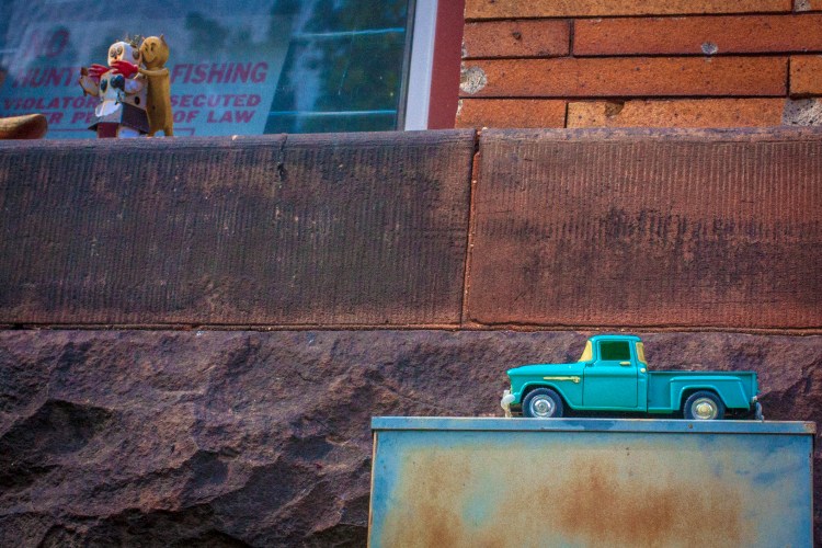 Someone has set up several old toys outside their home window Not So SAHM