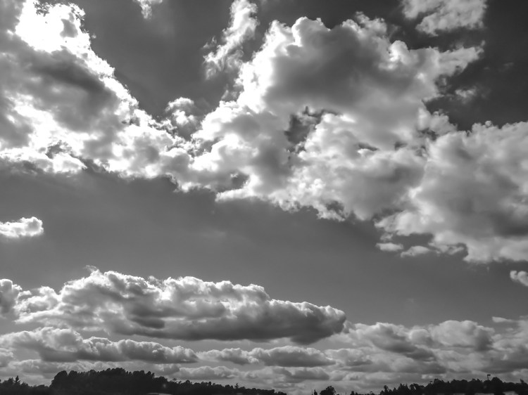 Fluffy, cotton-like clouds fill the sky. Not So SAHM