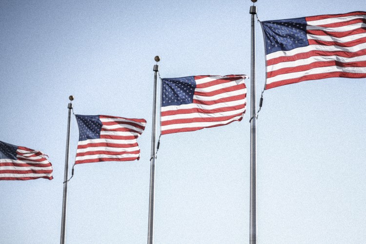 American flags wave in the breeze. Not So SAHM