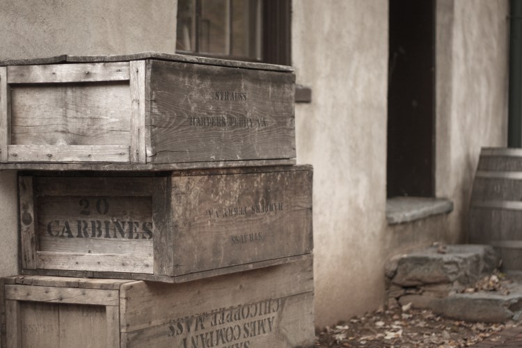 Boxes of carbines sit outside of a building at Harper's Ferry. Not So SAHM