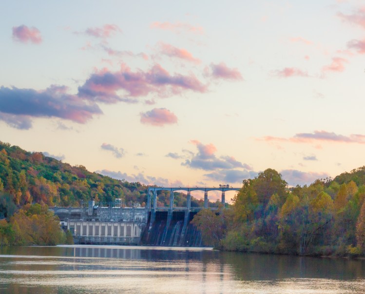 A dam sits nestled in the fall trees in Virginia. Not So SAHM