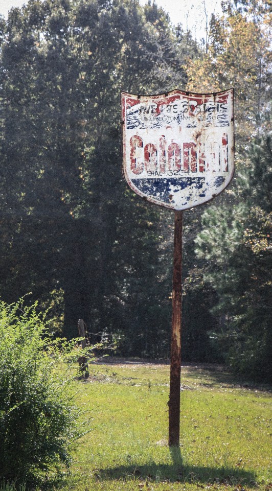 An old Colonial sign stands rusted along side a country road. Not So SAHM