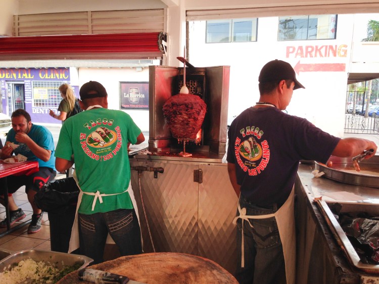Two chefs fix tacos at a street corner open restaurant in Rosarito, Mexico. Not So SAHM