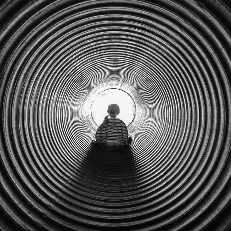 Girl slides down a hole that looks like the Twilight Zone. Not So SAHM